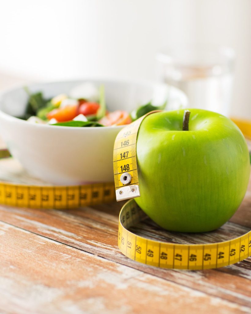 close-up-of-green-apple-and-measuring-tape-2026-03-09-07-59-42-utc (1)