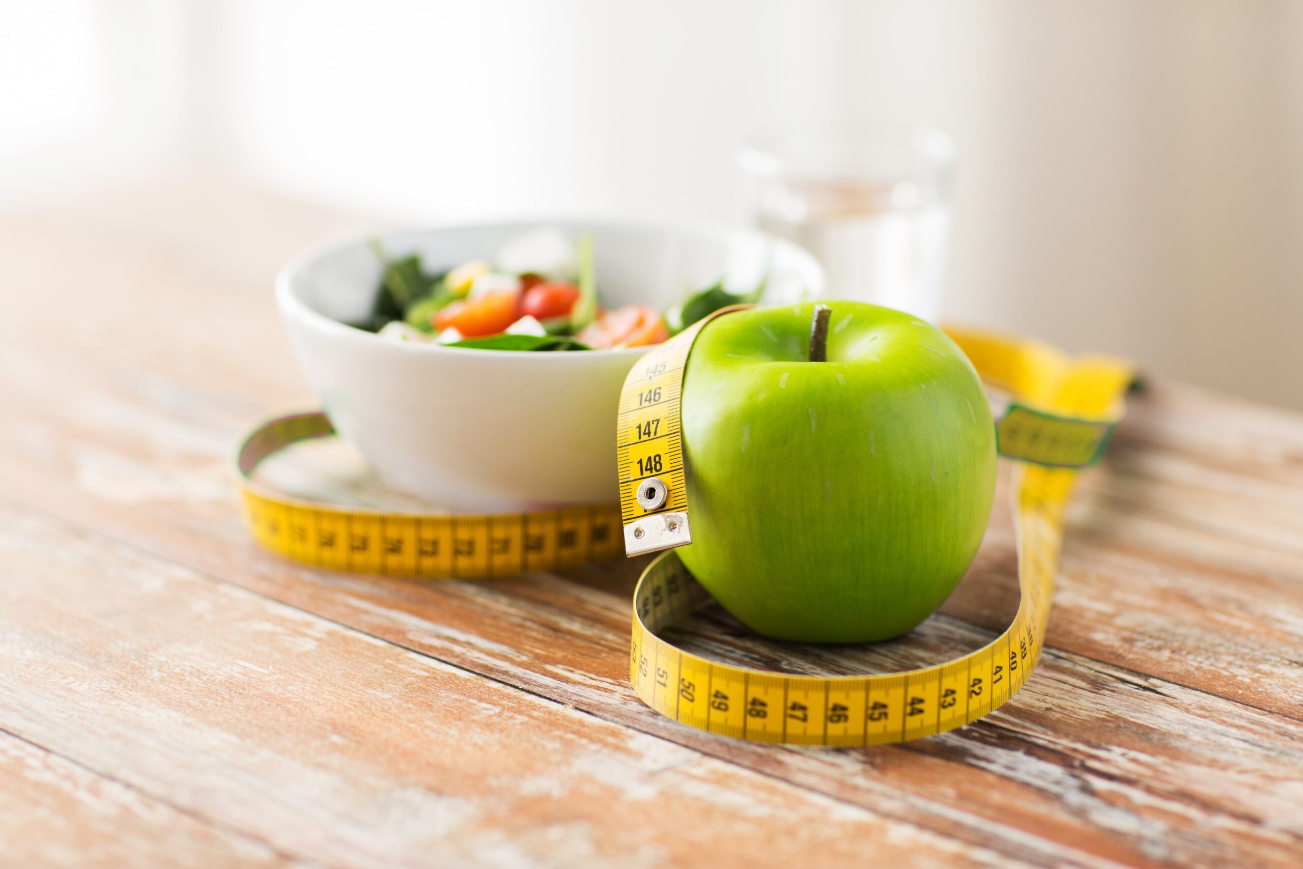 close-up-of-green-apple-and-measuring-tape-2026-03-09-07-59-42-utc (1)