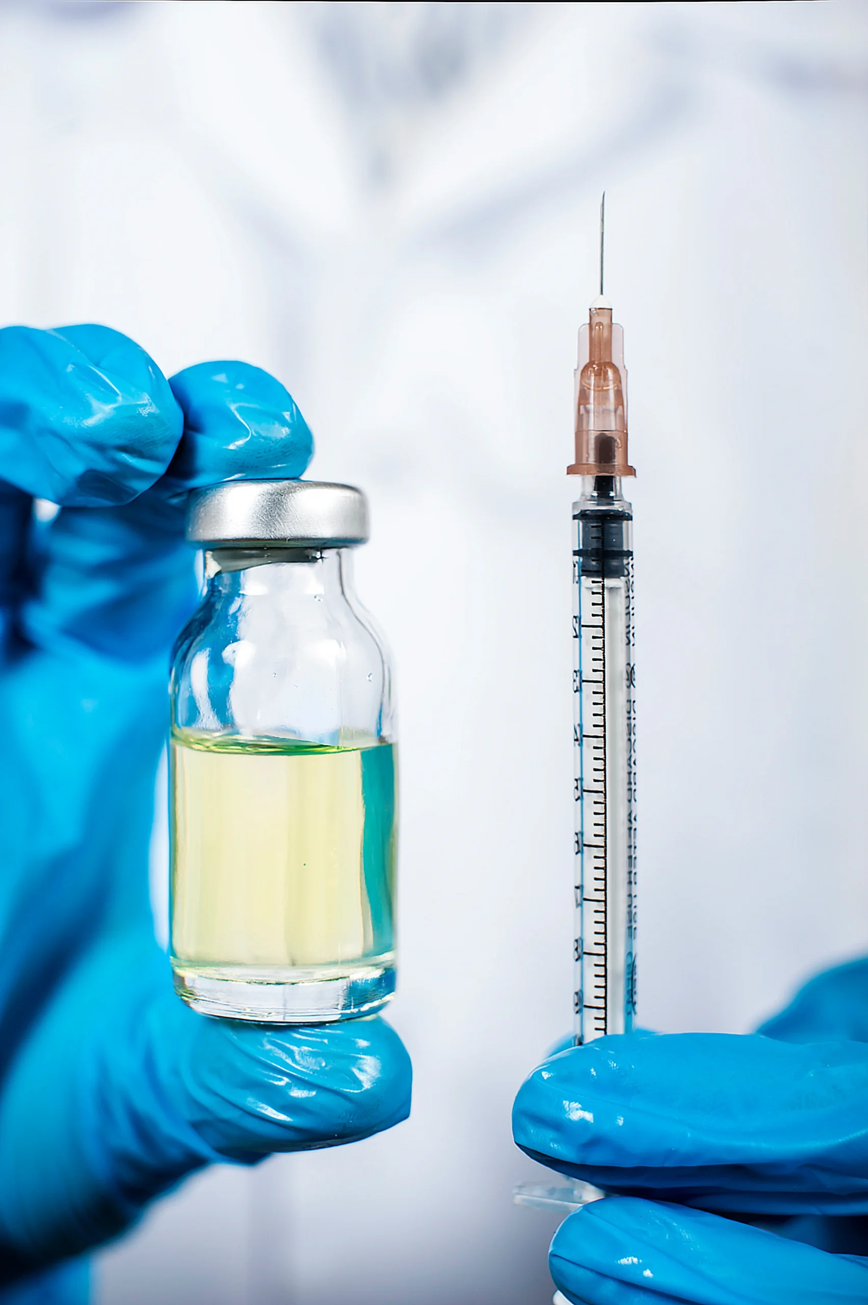 doctor-in-medical-gloves-holding-medicine-and-syri-2026-01-07-06-06-26-utc