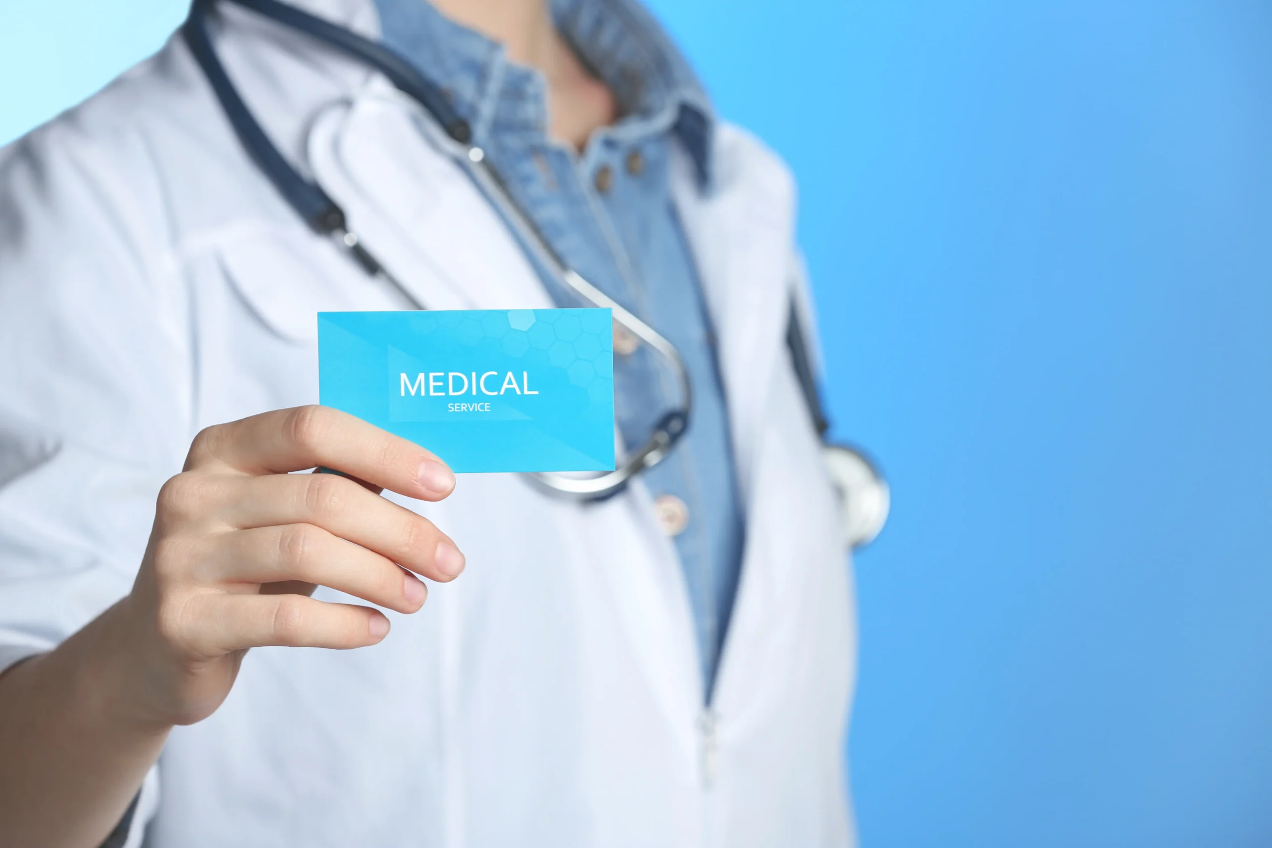 medical-professional-holding-business-card-for-ser-2026-03-05-21-12-42-utc