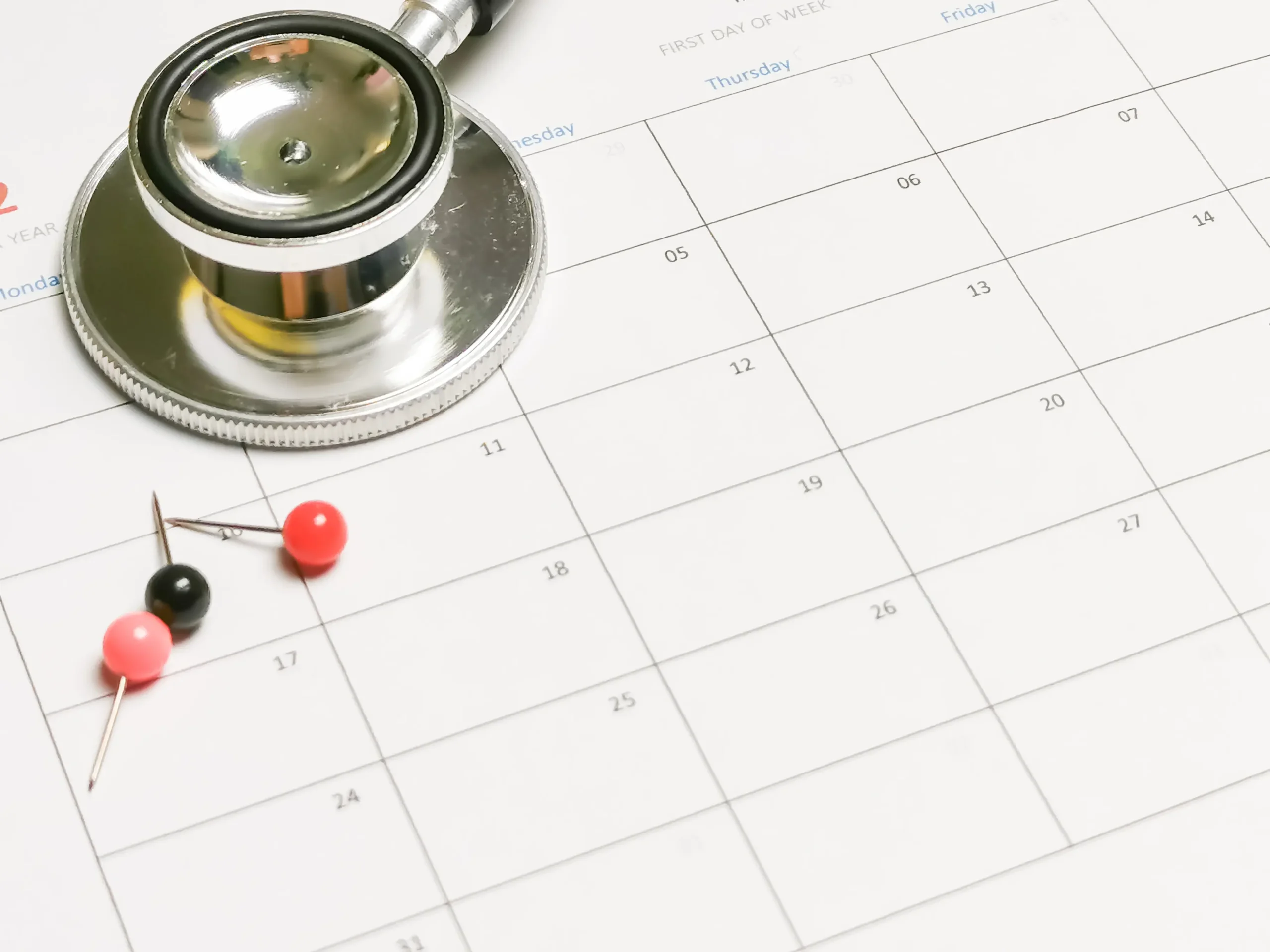 stethoscope-and-pins-on-a-calendar-for-appointment-2026-03-17-17-38-43-utc